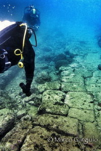 Swimming on the ancient roman street, Via Erculeanea. Baia by Marco Gargiulo 